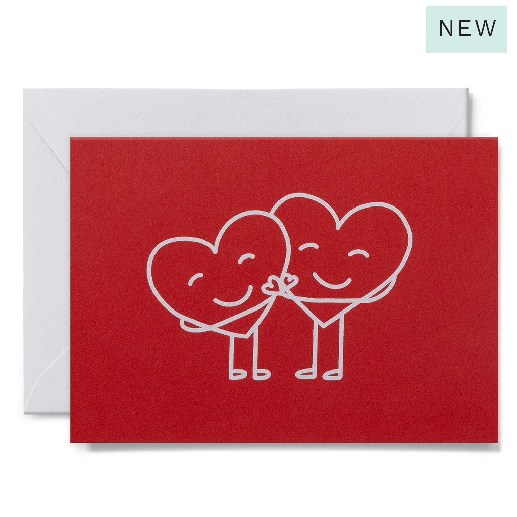 Red card with white heart-shaped characters holding hands