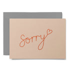Apology card with sorry text and heart