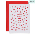 Greeting card with red hearts and text 'These hearts are for you' 